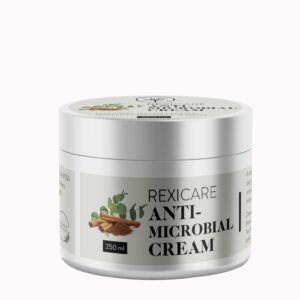 A silver jar of REXICARE Anti-Microbial Cream with a white label, featuring a graphic of cinnamon and eucalyptus, set against a plain white background.