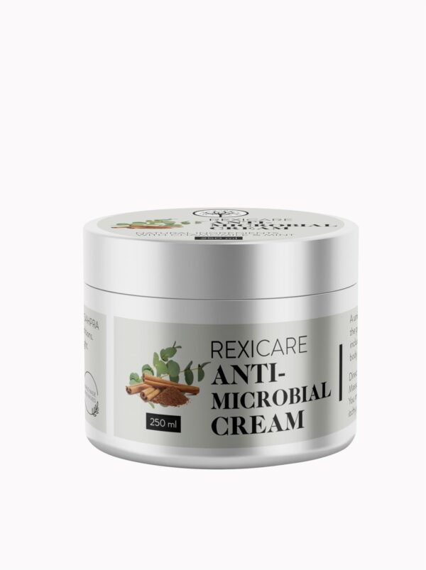 A silver jar of REXICARE Anti-Microbial Cream with a white label, featuring a graphic of cinnamon and eucalyptus, set against a plain white background.