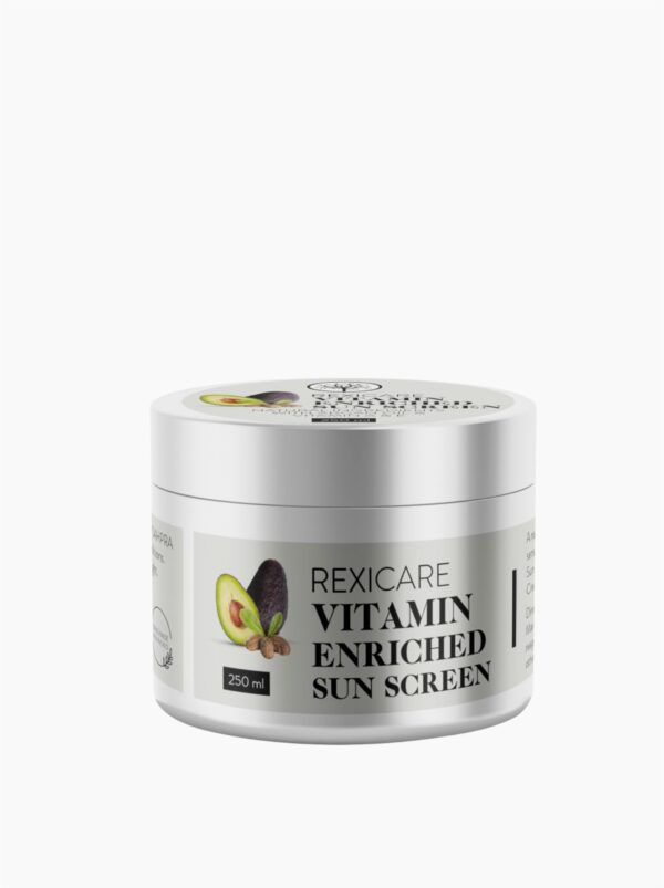 A white jar of Rexicare Vitamin Enriched Sun Screen, showing a label with illustrations of an avocado and a nut, and the product name.