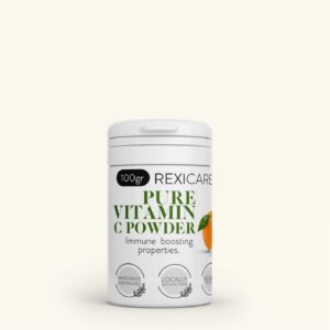 A white jar of Rexicare Pure Vitamin C Powder is shown, with a label featuring an illustration of an orange and information about the product. The label states "100gr" and "Immune boosting properties."