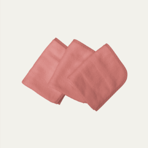 Three folded, square-shaped, plush cloth wipes in a vintage antique rose color, arranged in a staggered stack on a light background.