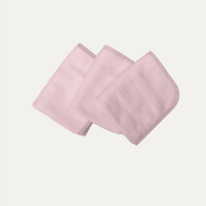 A stack of three baby pink, rectangular, microfiber cloths is shown.