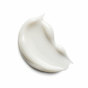 A thick, textured smear of white cream or moisturizer on a white background.