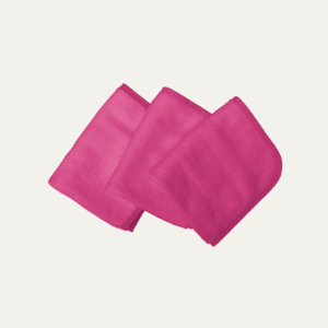 Three folded, square-shaped, plush cloth wipes in a vibrant mulberry pink color, arranged in a staggered stack on a light background.